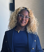 female with black hair wearing blue