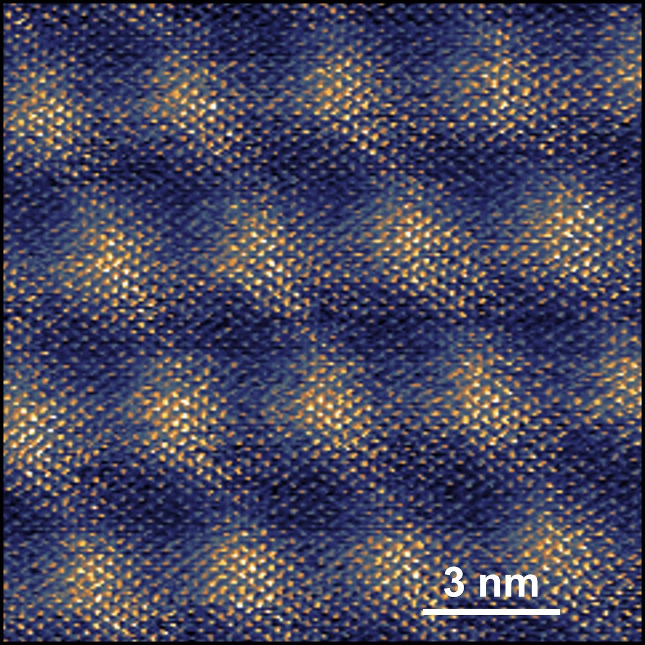 Image: Atomic-resolution moiré patterns imaged on a twisted graphite-graphite interface, recorded via conductive atomic force microscopy under ambient conditions. Image by the Baykara Lab.