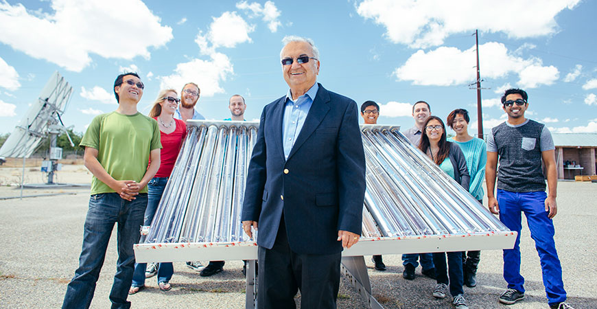 Professor Roland Winston and some of his student researchers with a solar collector